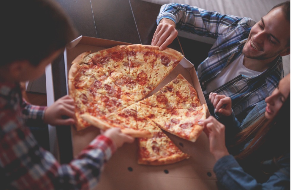 Friends sharing pizza